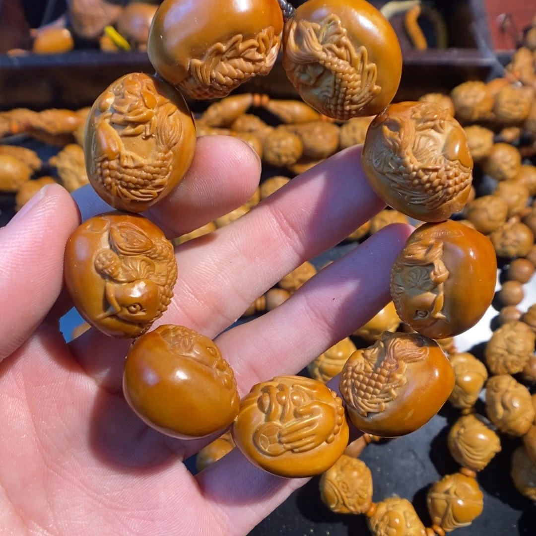 橄榄核手串/手链荷花鱼