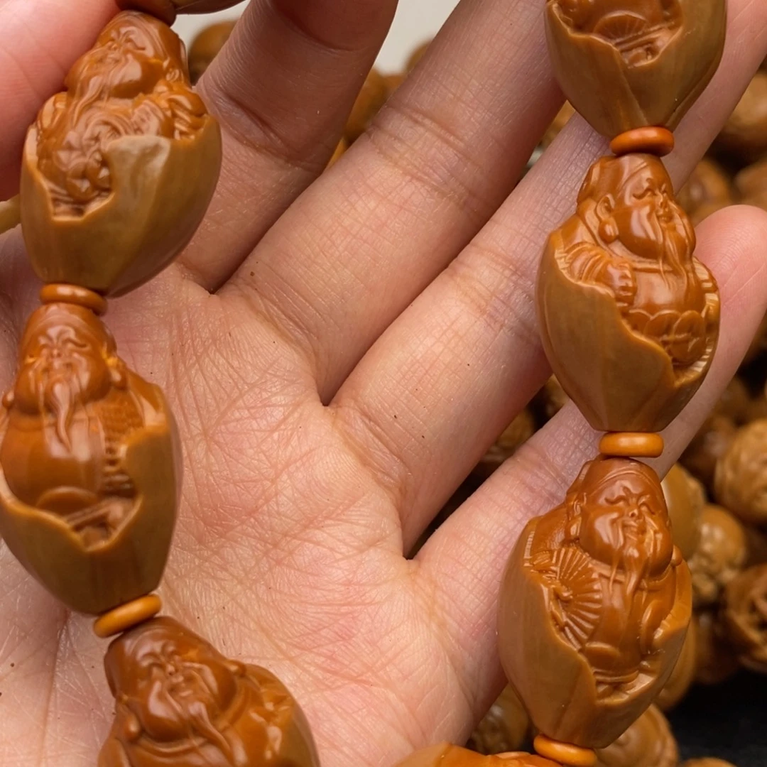 橄榄核吊坠包衣财神