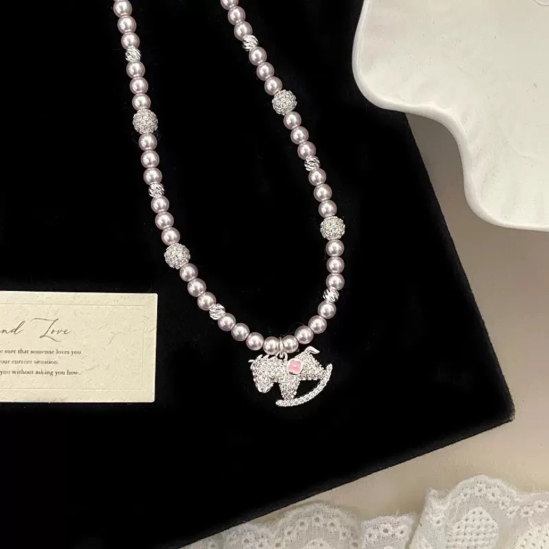 铜仿珍珠项链 YISLON 曼塔玫瑰施家珍珠满钻锆石甜美木马项链