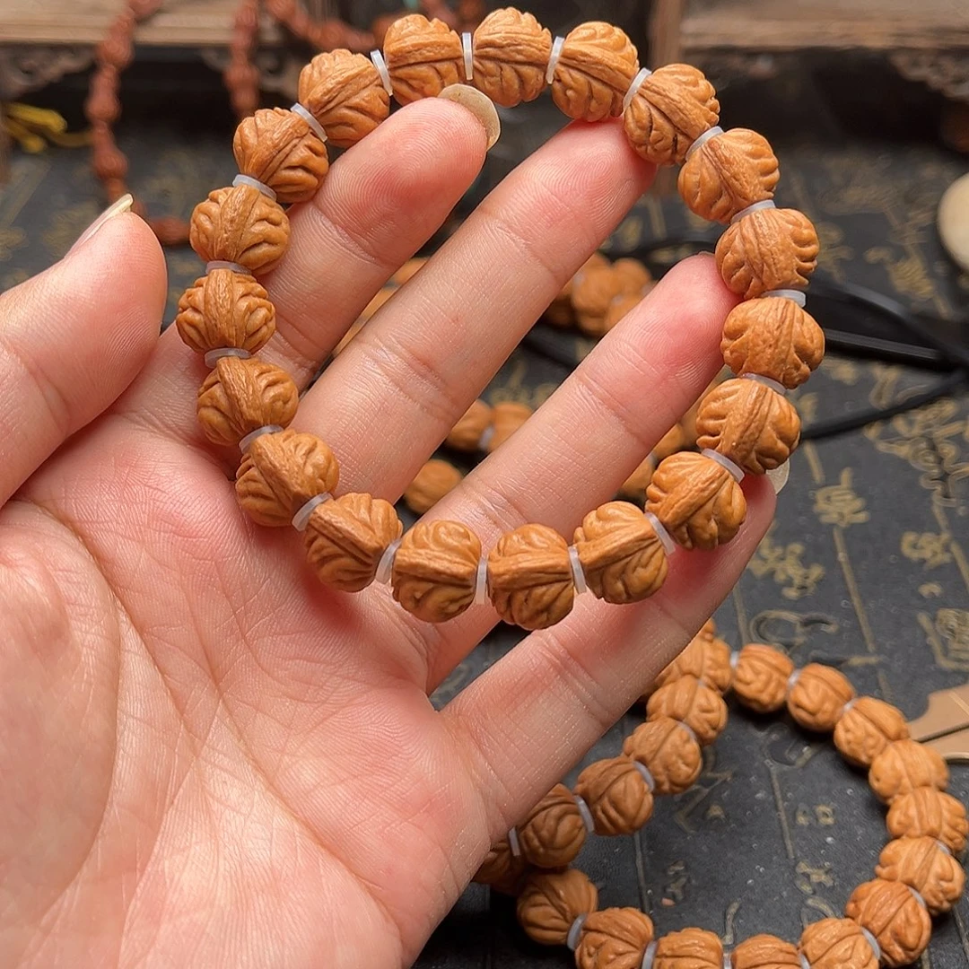 吊坠桃核赤金风雨手串