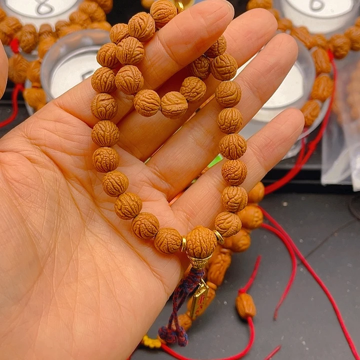 自***翔桃核吊坠见健健康康平平安安9