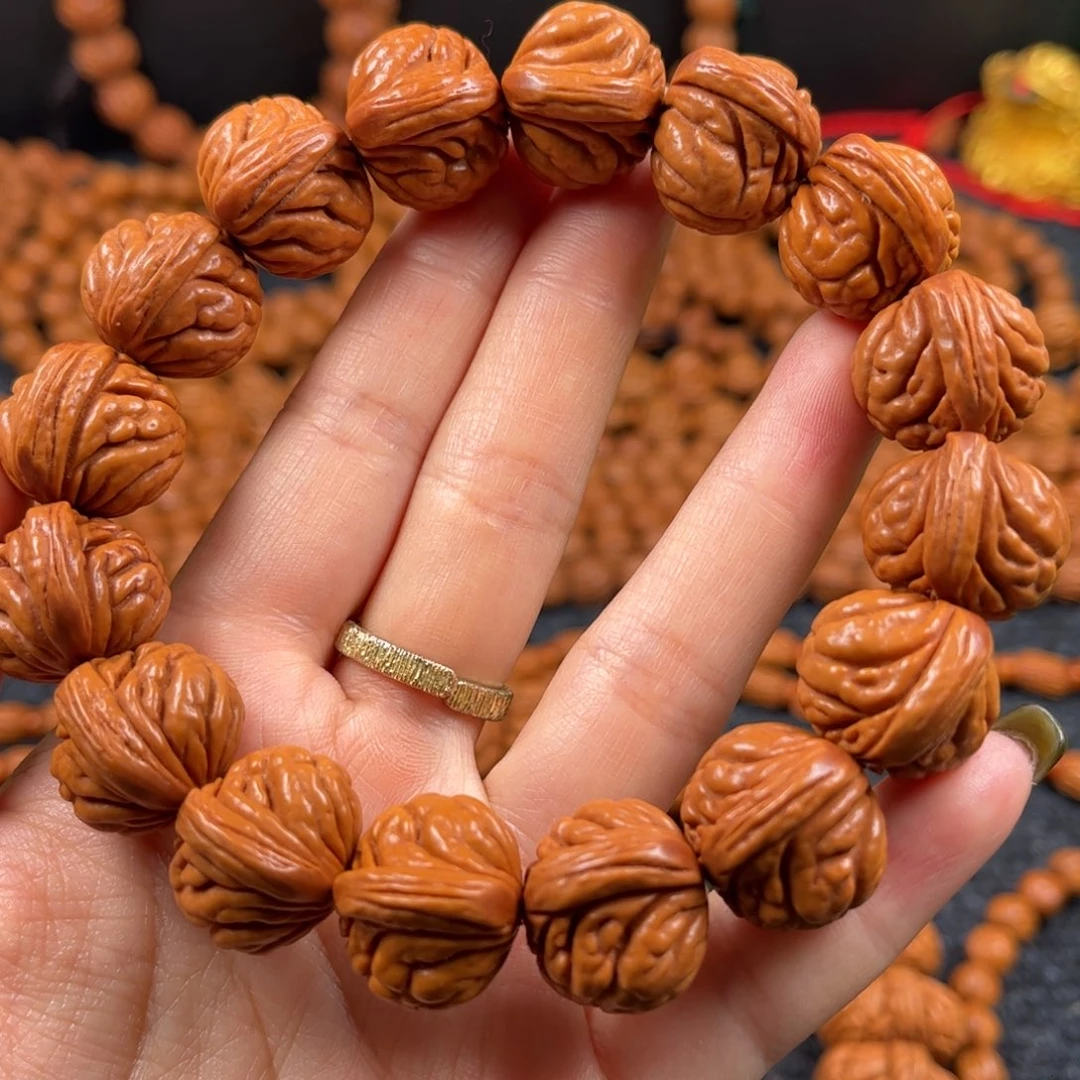 闲***适手串桃核A4链接手串