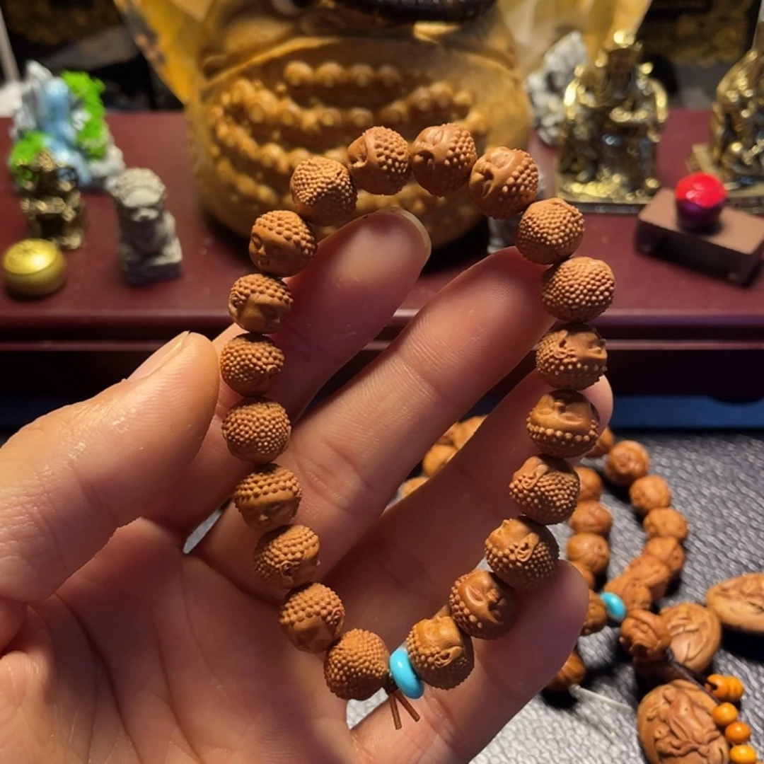 龙纹桃核雕刻宝宝佛