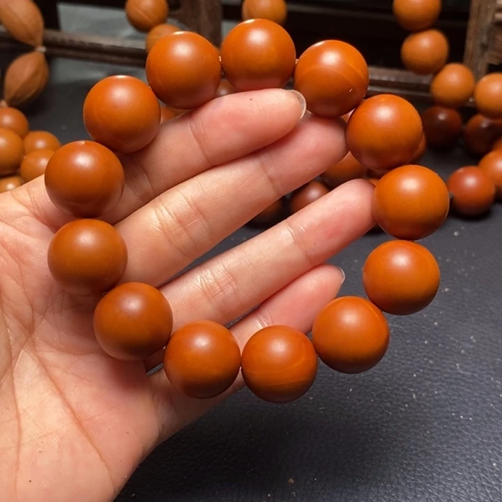 橄榄核手串1.7尺寸红料光珠小孔