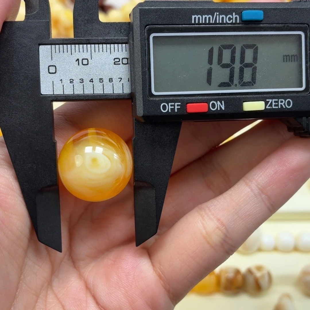 琥珀未镶嵌珠宝奇石焦皮金橘白溶洞台风眼圆珠19.8mm