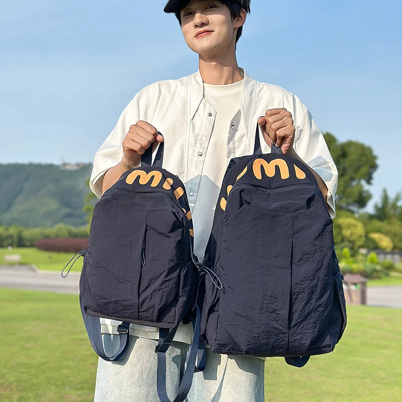 双肩包男简约百搭休闲双肩包女两用斜跨包轻便旅行背包学生书包