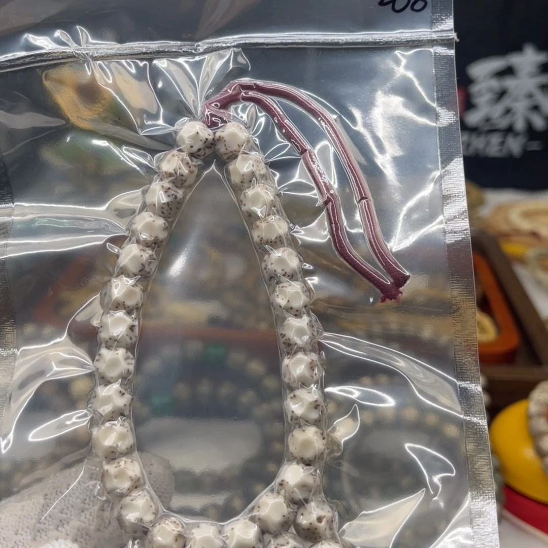手串星月菩提石玉骨瓷白9×8无相雕刻半壁留白手持