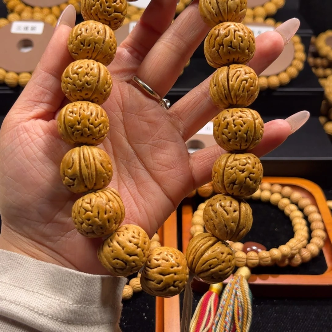 自***。桃核手串川上文玩出品沈阳老树王