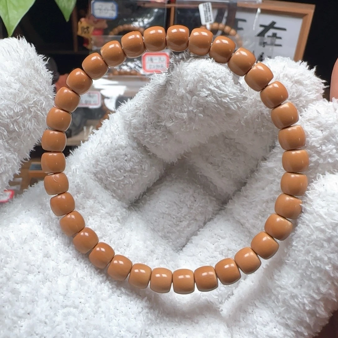 仙***莫橄榄核吊坠清水树王6.8mm三花单圈