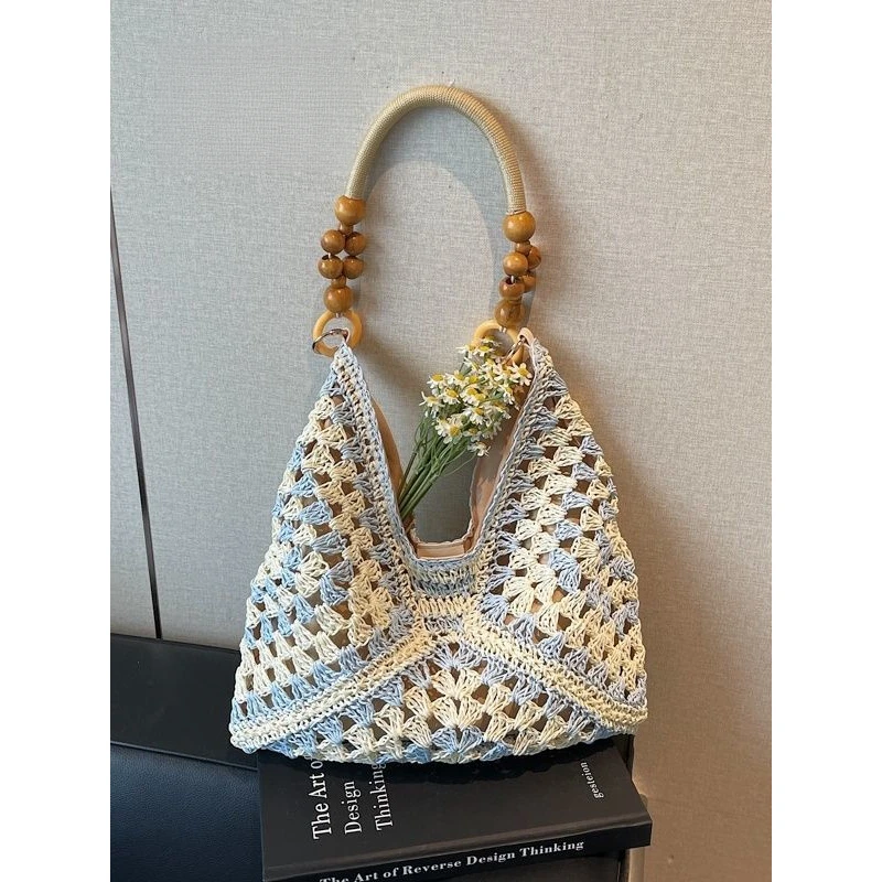 夏天简约草编包包女2025新款海边沙滩镂空单肩包手提编织菜篮Q