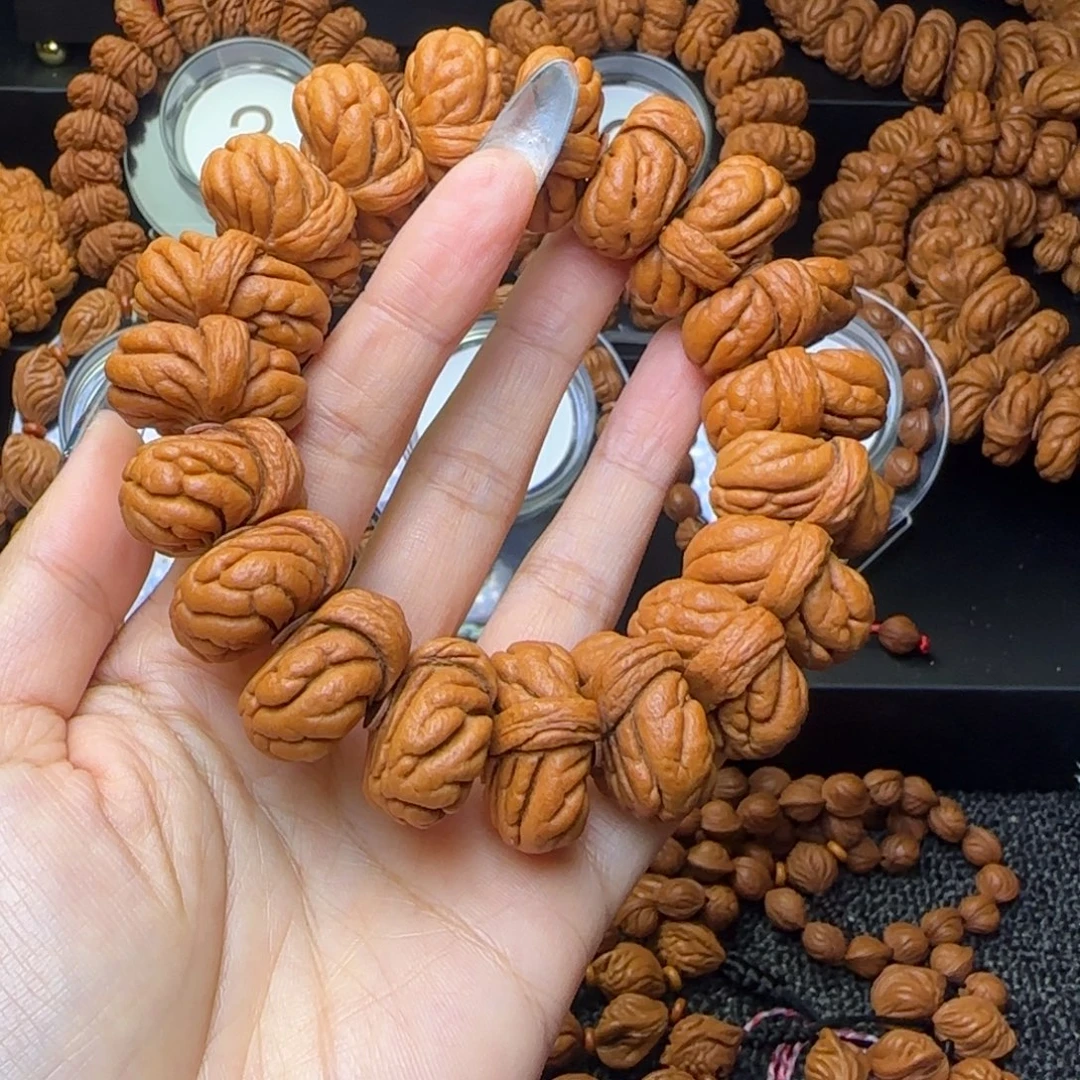 昊***板手串桃核霸王龙手串