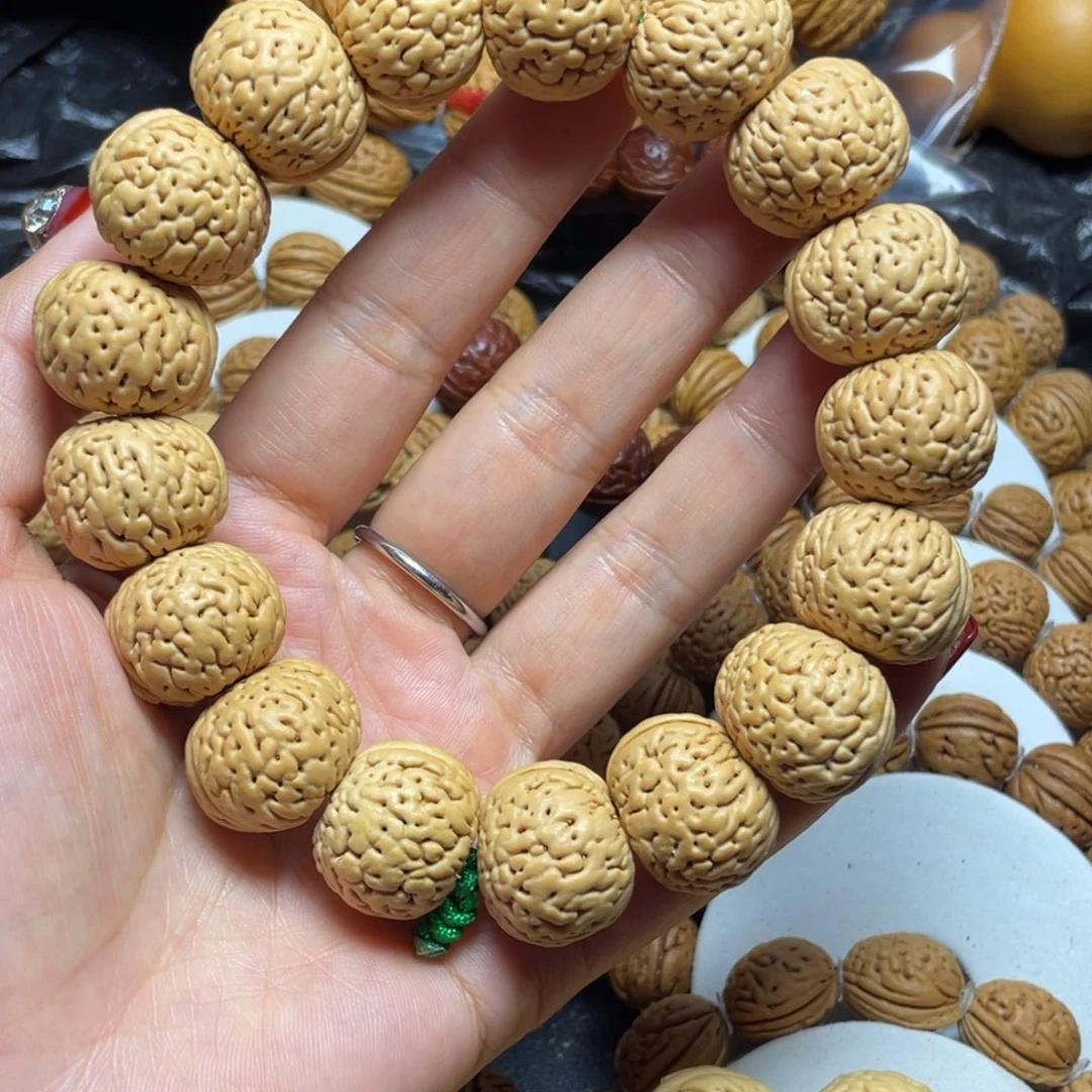 刘***野桃核吊坠桃核手串21+苹果园