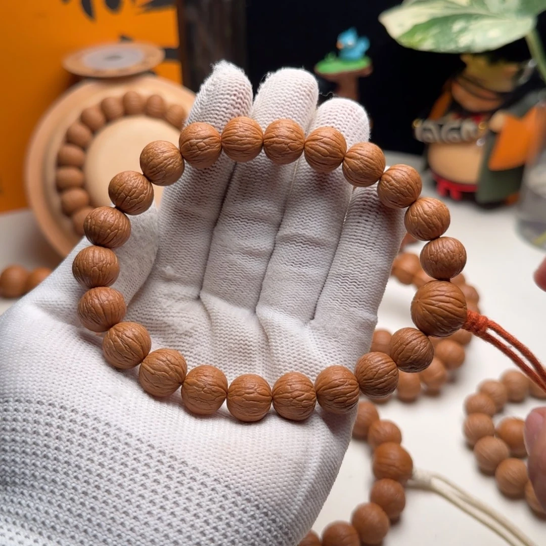 K***。猴头核桃手串12➕同尺磨盘凤羽