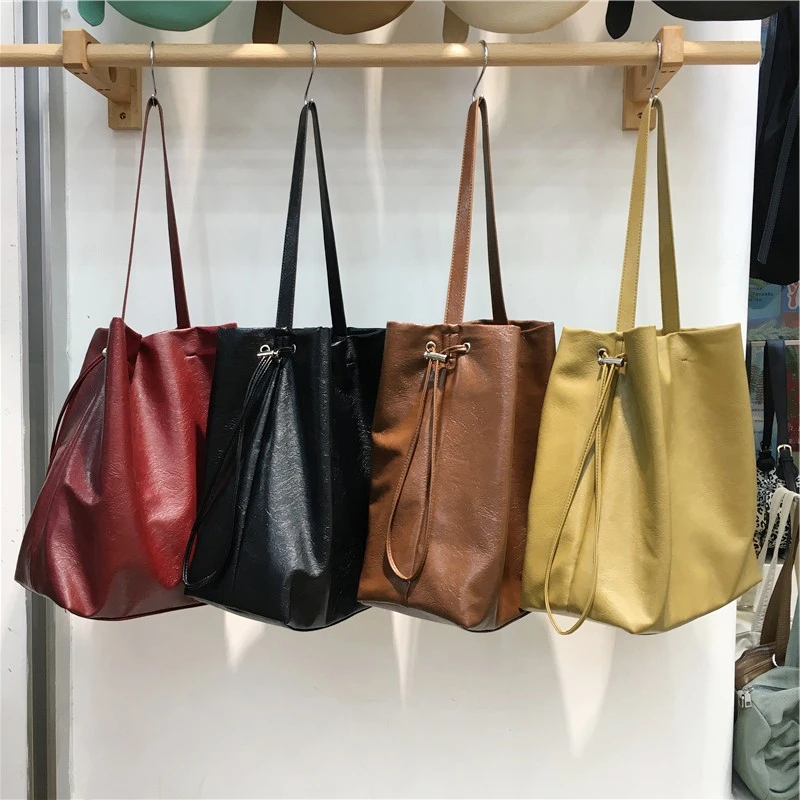 韩系慵懒风水桶包复古小众软皮通勤大容量抽绳单肩腋下包