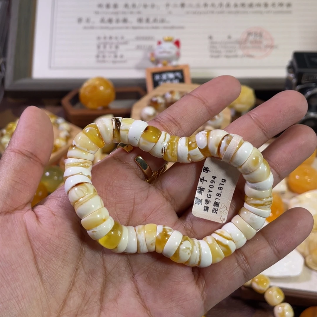 琥珀未镶嵌裸石11mm 金瓷白溶洞妖花扭扭肠单圈GY094