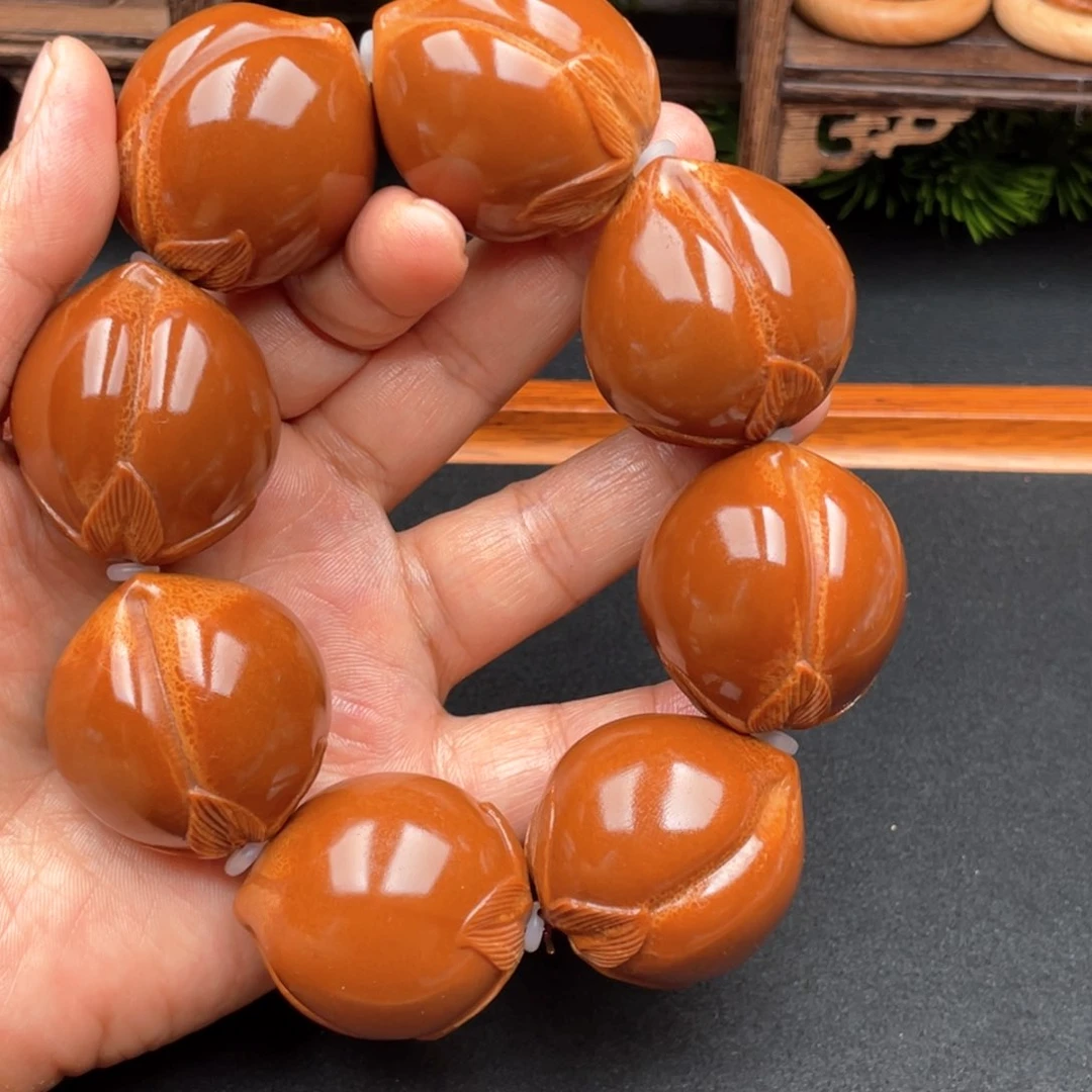 橄榄核吊坠寿桃手持