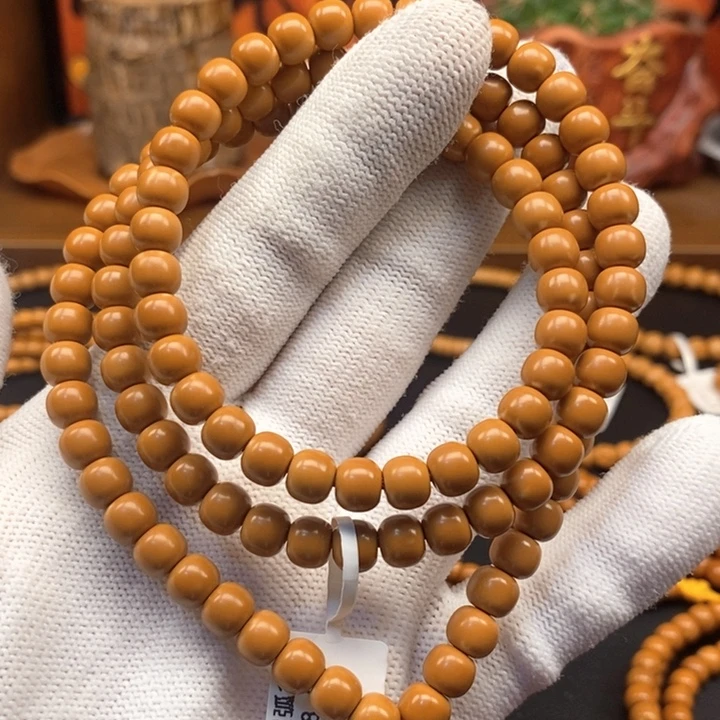 十***街橄榄核吊坠6.8老挝核尖极限弧108微白保真