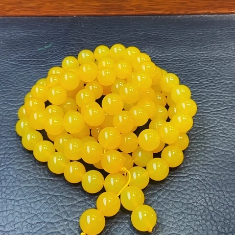 手饰玛瑙未镶嵌雪玉龙皇参108颗，卡14