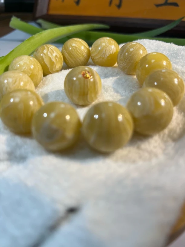 『骨艺精品102号尺寸1.4正圆手串-北极牛角千层雪妖孽花纹带标单珠