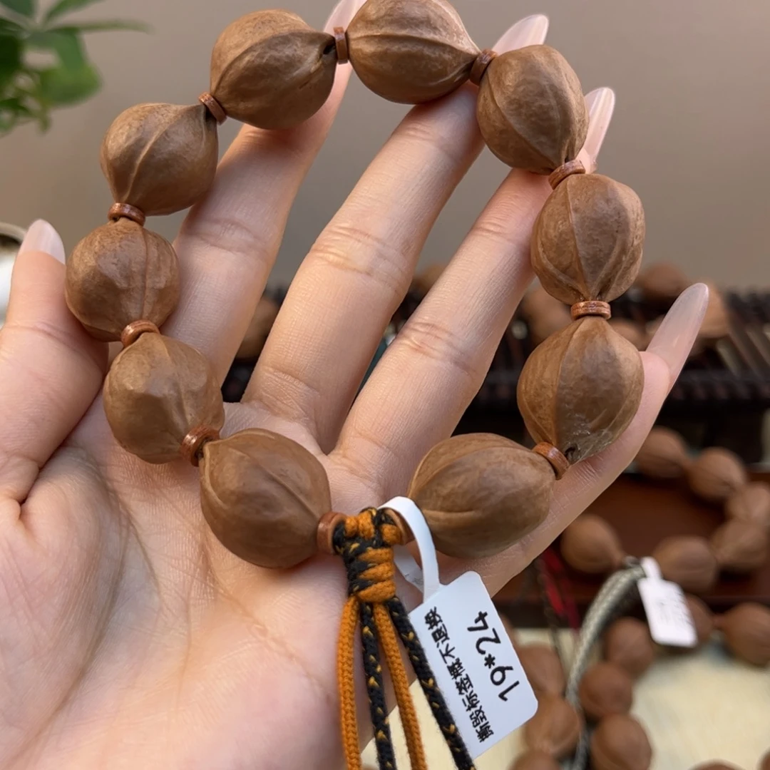 雨***天吊坠橄榄核梅林铁核文玩手串