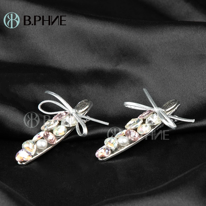 B.【贝菲】彩色蝴蝶结鸭嘴夹