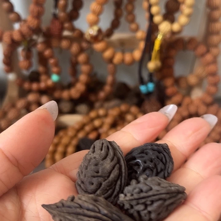 唐***角核桃把件野生桃枭黑碳化籽