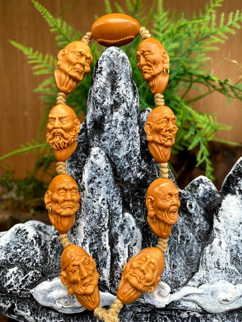 镜艺 八圣罗汉橄榄核雕手持