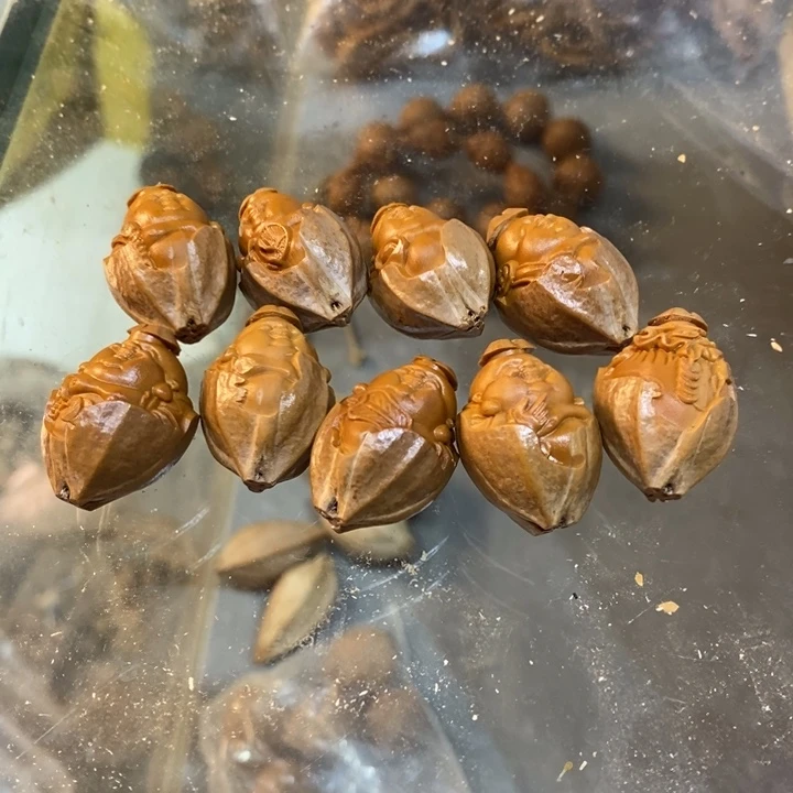 吊坠橄榄核蔷**尊