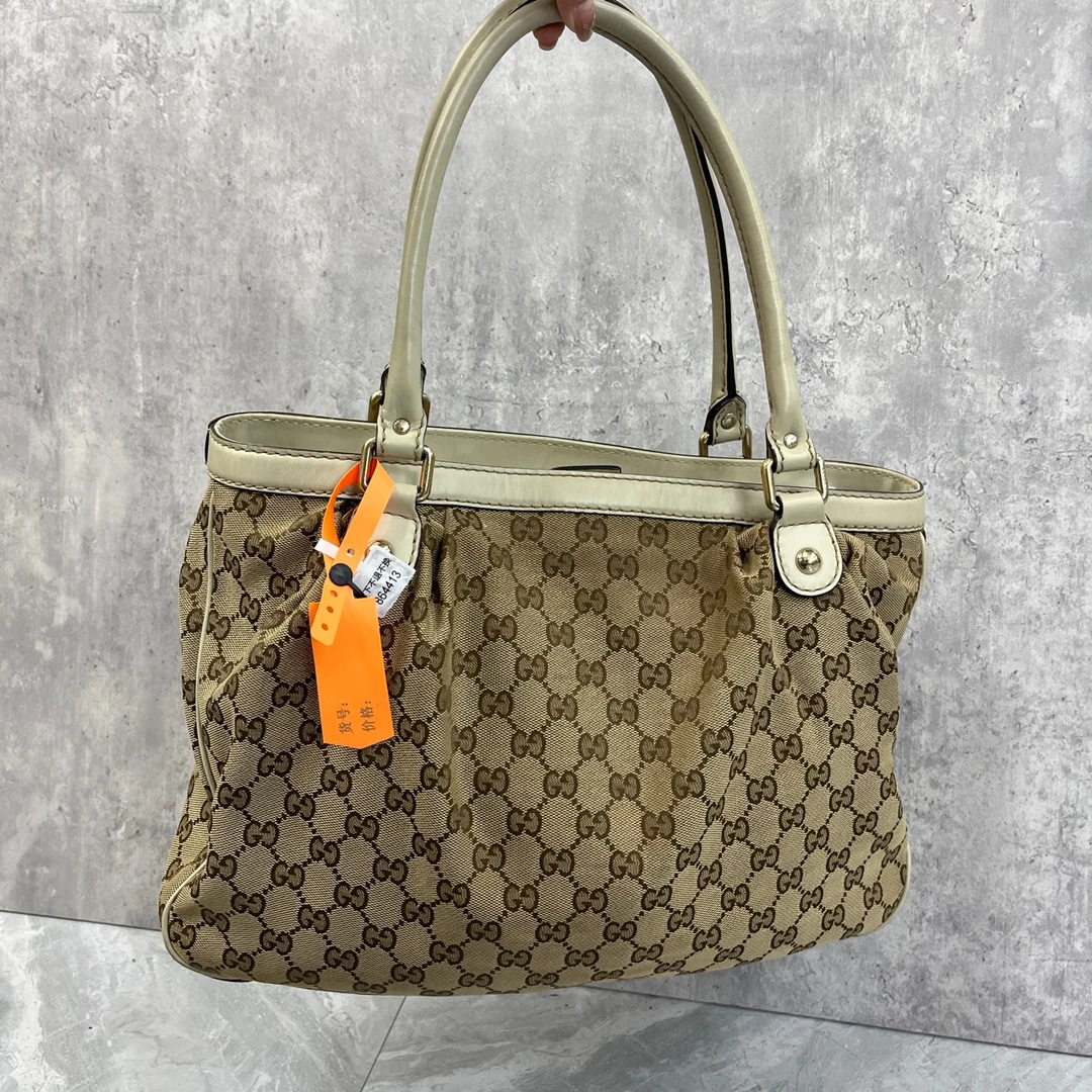 114 Gucci Sukey牛皮帆布老花双G吊饰单肩包 85新 864413