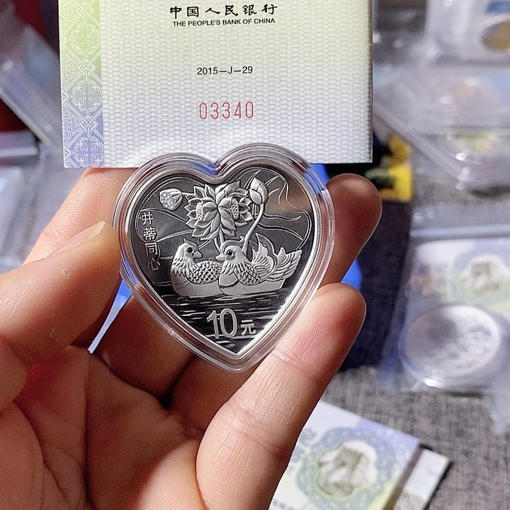 纯银夜**雨无盒带证书15年并蒂同心银币一枚如图