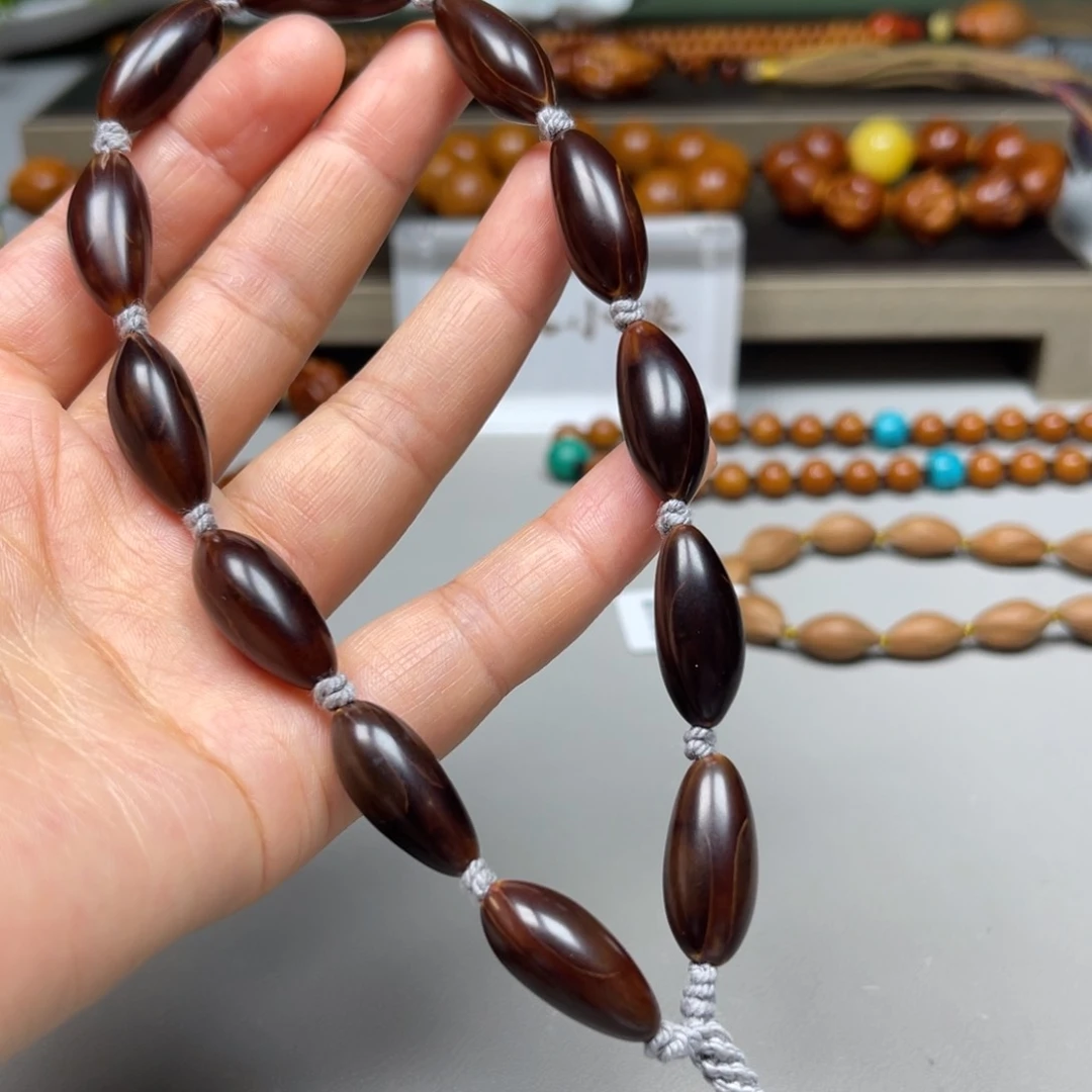 橄榄核吊坠紫皮手持