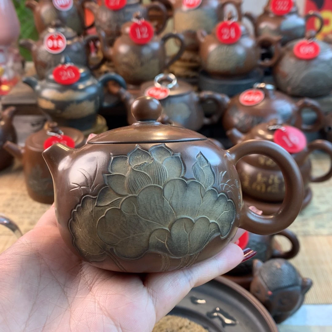 拼**天黎昌权浮雕花壶