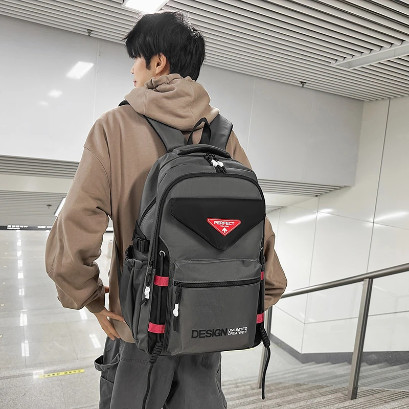 新款大容量撞色休闲初高中潮流大学生书包男轻便减负外出双肩背包