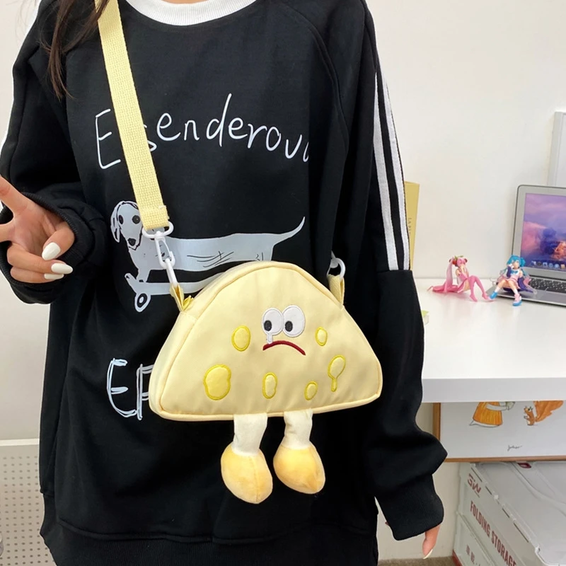 帆布包包女2025新款网红刺绣搞怪奶酪斜挎包学生女生小表情单肩包