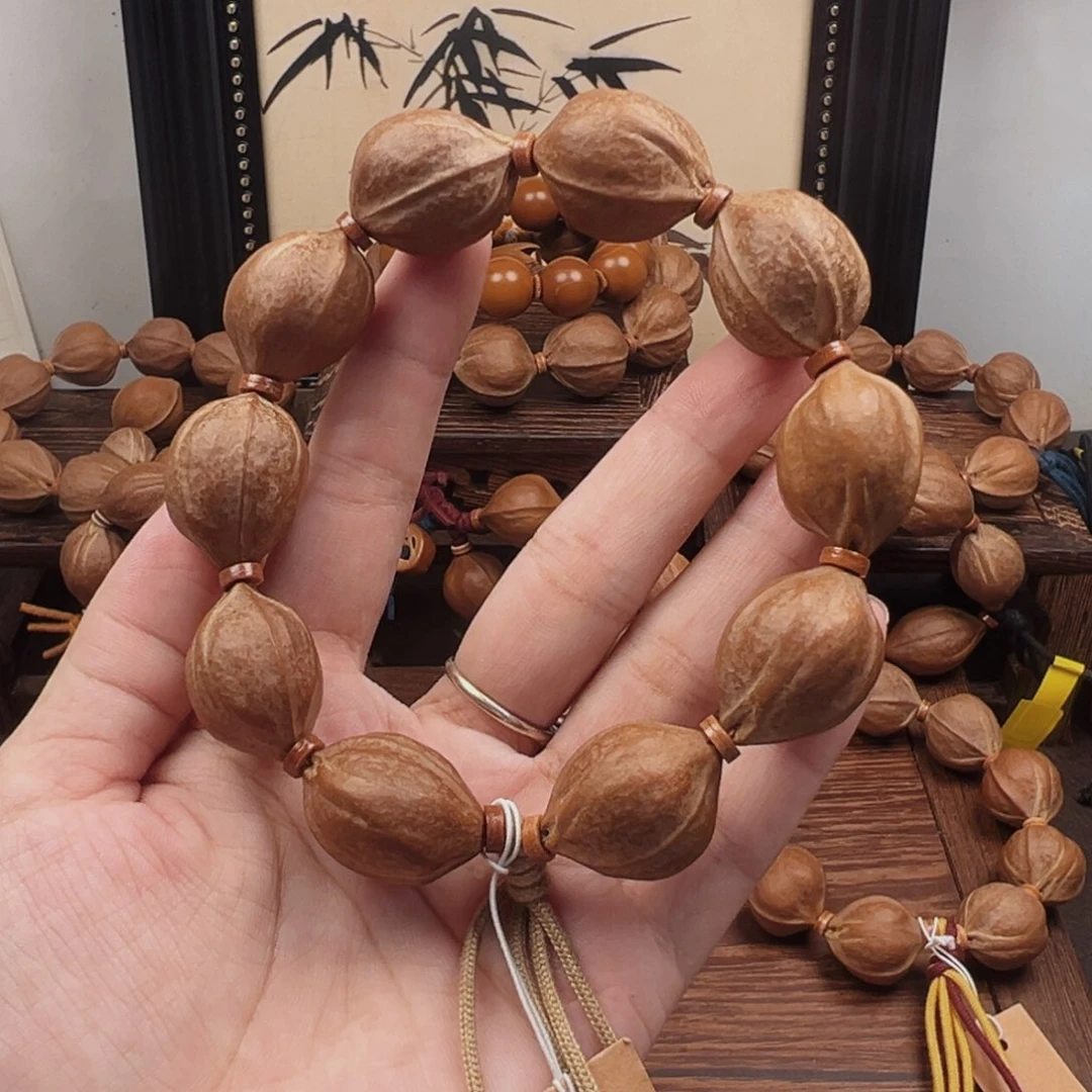 熄***花手串橄榄核20.25梅林铁核