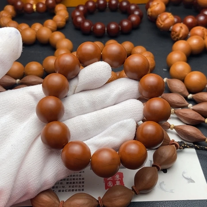 星***海橄榄核手串/手链1.7鸡血红铁核同轴