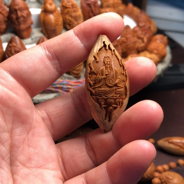 杭***艺橄榄核吊坠橄榄核雕刻手把件