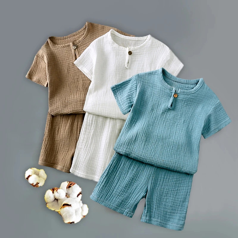 薄软透气男女宝宝夏款新款套装儿童棉麻纽扣短袖T恤短裤两件套