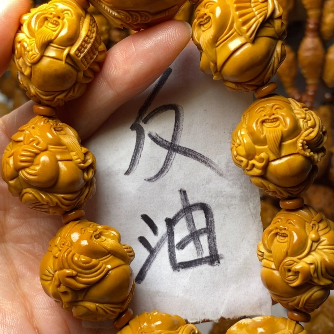 弘***馆手串/手链橄榄核上色财神精品