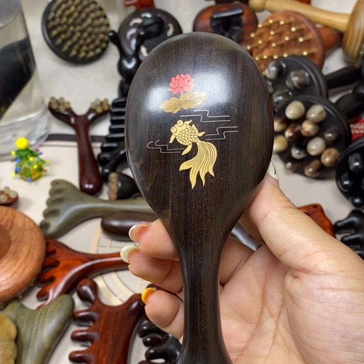 紫光檀锦鲤羊角梳