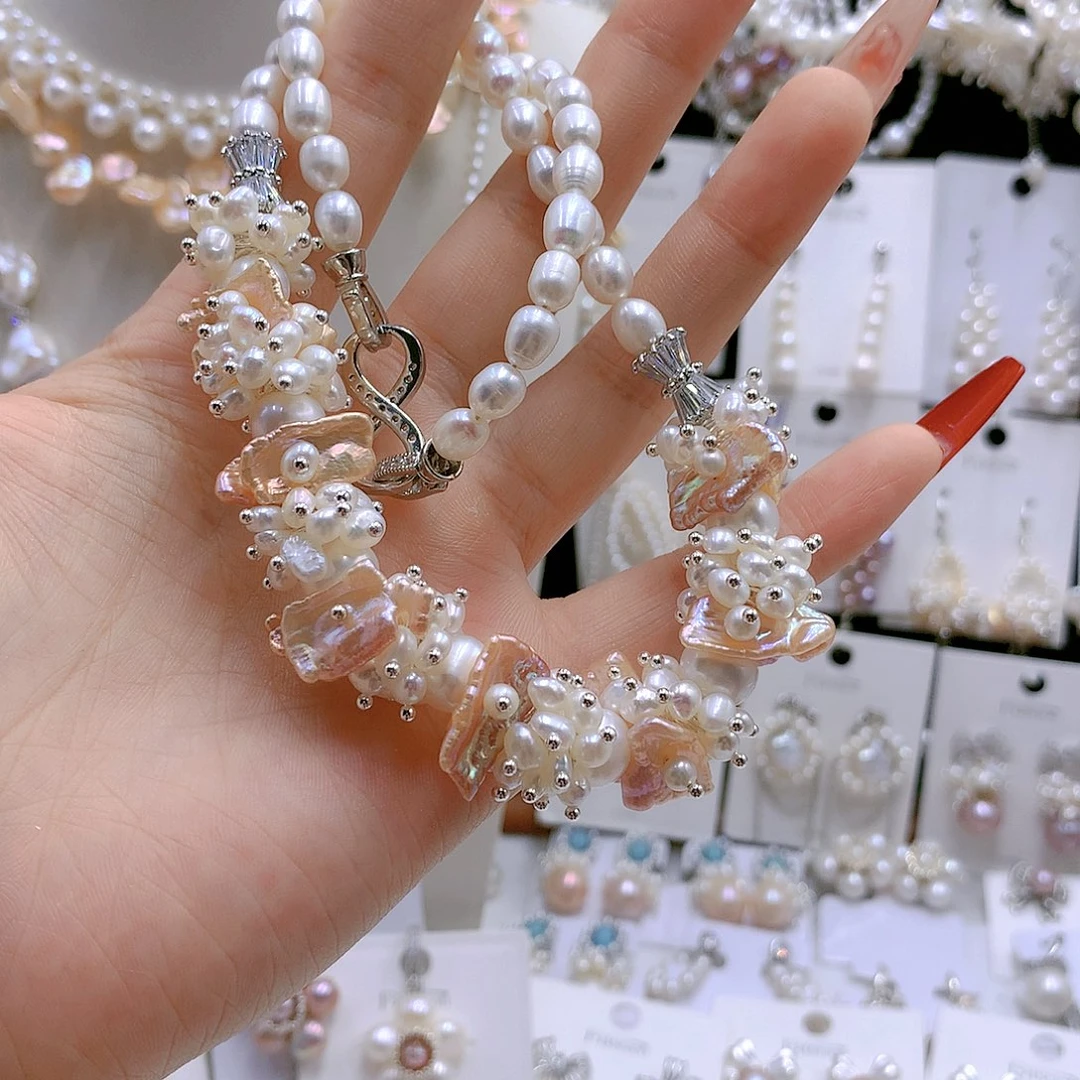 银S925镶嵌耳饰淡水珍珠芝**?