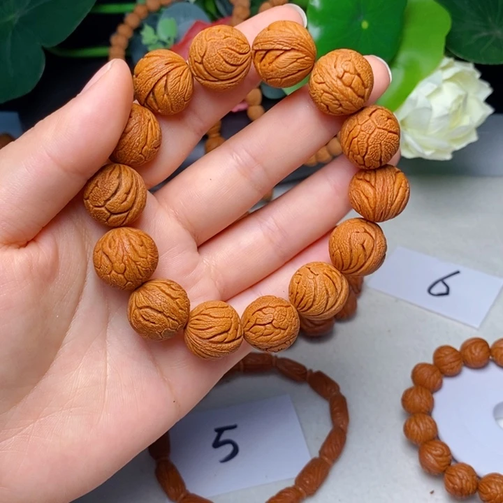 桃核手串金丝龙珠