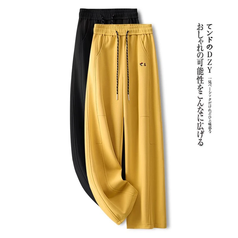 拉夏贝尔休闲阔腿裤女春秋季2025新款垂坠感弯刀裤时尚黄色直筒裤