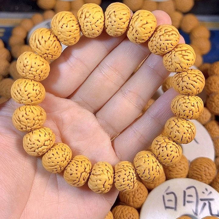 为***红手串桃核树王纽扣桃核手串