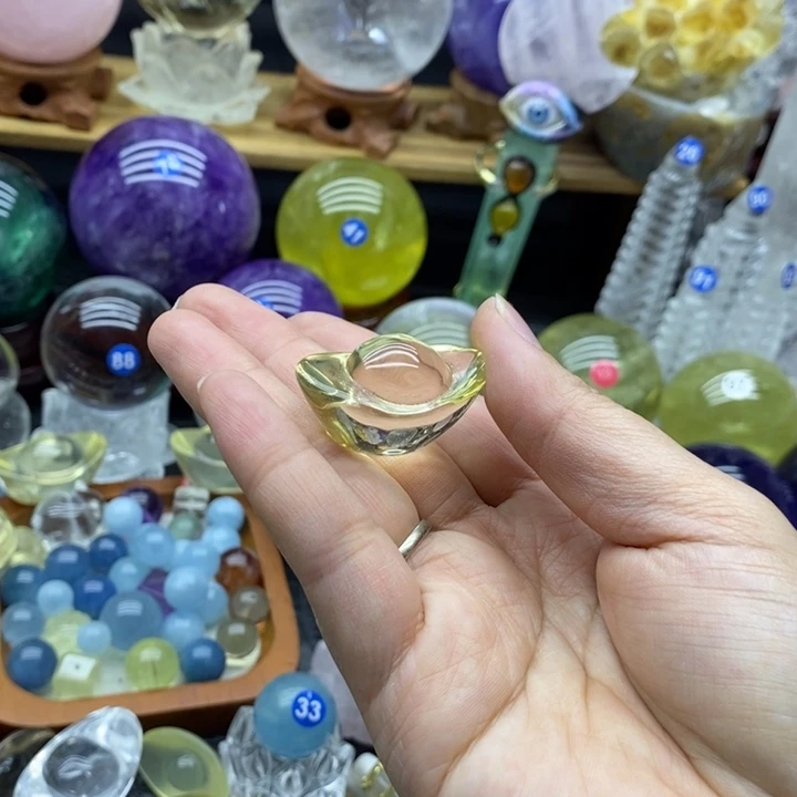 心***花石材天然黄水晶元宝