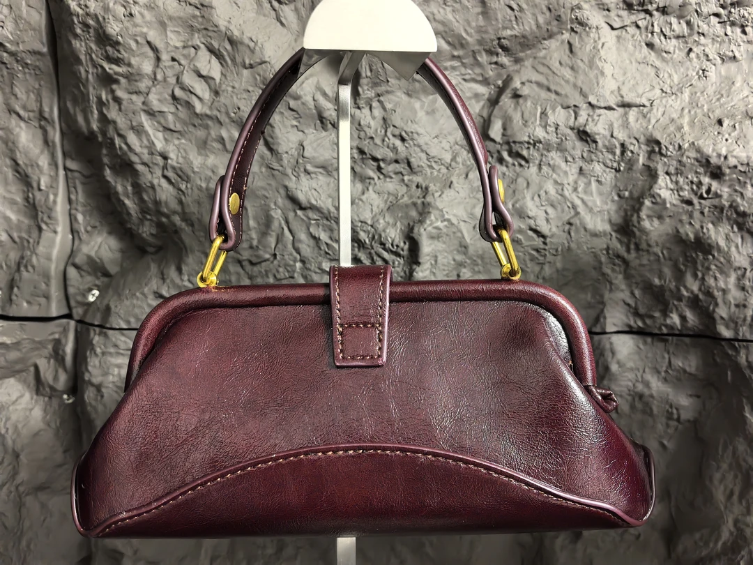 高级至新款百搭夹子复古凹造型手提包