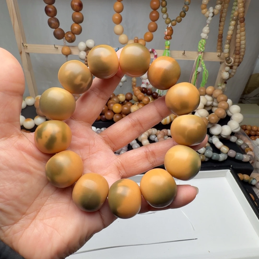 妞***手串菩提根/象牙果卡22左右干磨瑕疵
