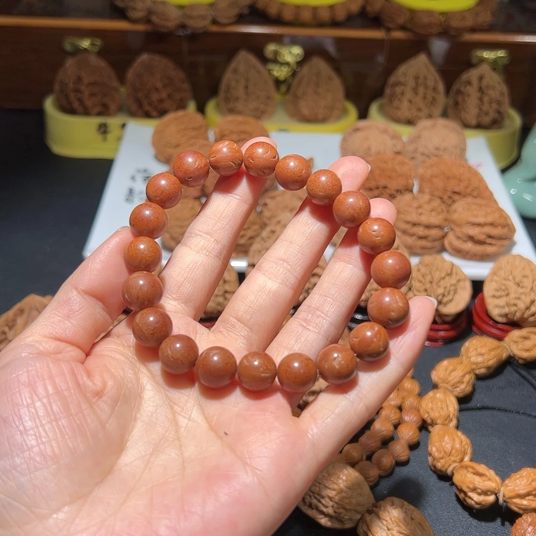 文玩核桃把件弄*光珠手串