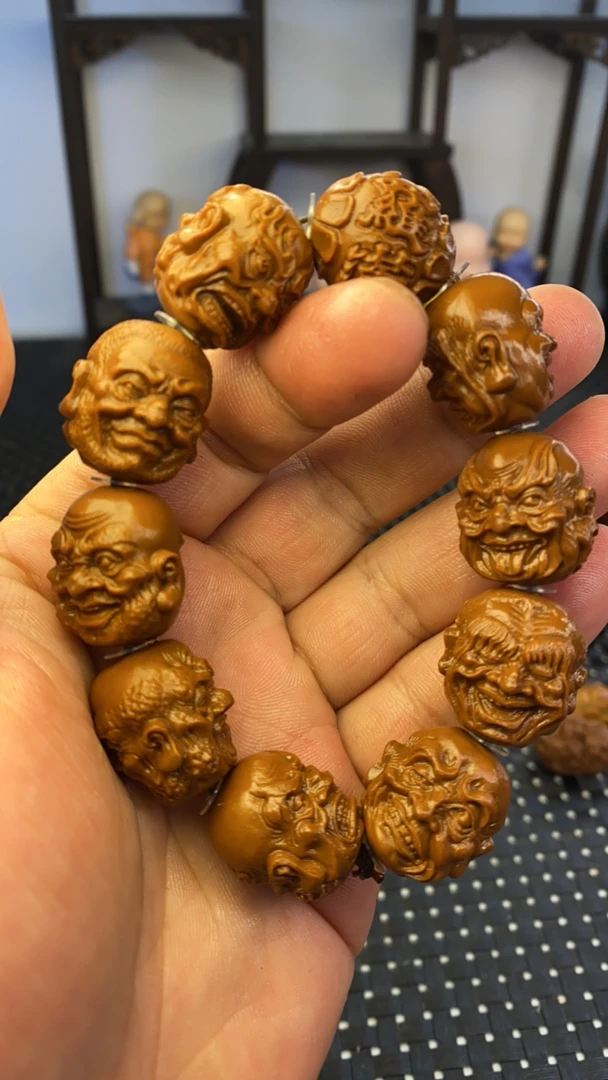 山鬼2.0十八罗汉雕刻手串是黄金树上黄金核不是橄榄核是黄金核