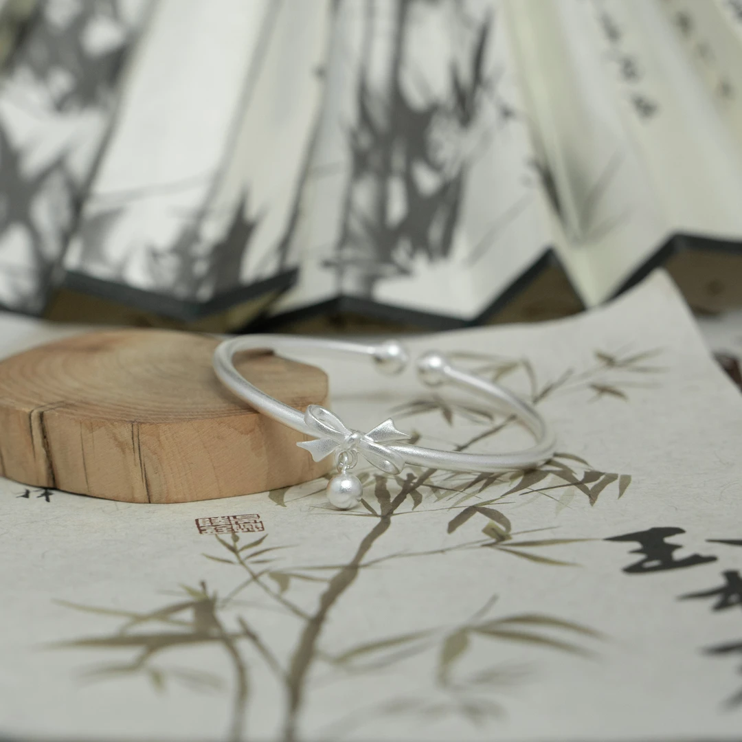 足银手镯 古法蝴蝶结吊铃手镯/17克/足银999.9